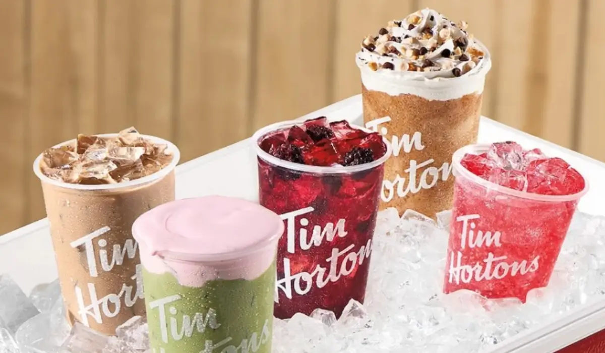 Tim Hortons iced beverages featuring strawberry cold foam, blackberry citrus refresher, iced capp and fruit-based drinks served over ice.