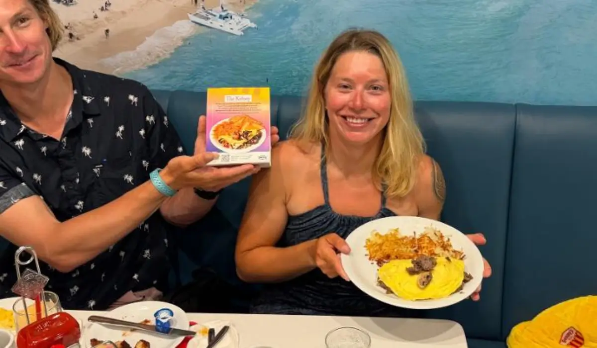 Kelsey Pfendler holds The Kelsey omelette at a Denny's restaurant after completing her historic solo Pacific Ocean rowing expedition.